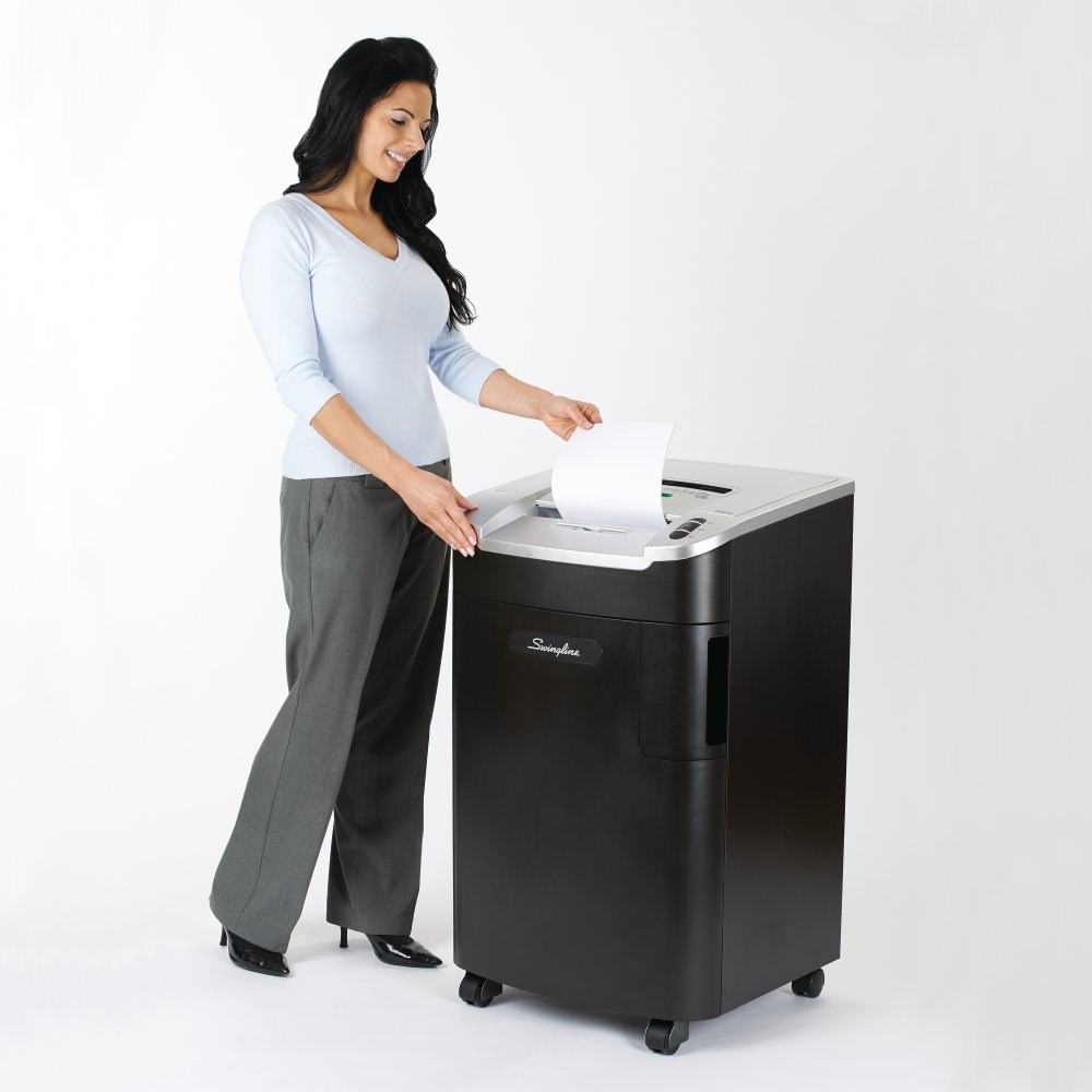Woman using a Commercial Paper Shredder