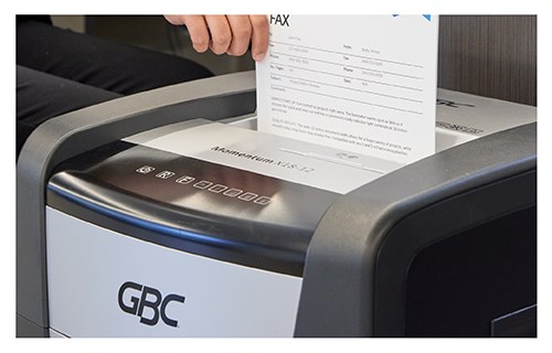 Side view of feeding paper into shredder